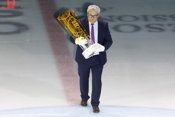 Willi Voegtlin, responsible for the National League&#039;s calendars, carries the trophy of National League Swiss Championship, prior the fifth leg of the National League Swiss Championship final play ...