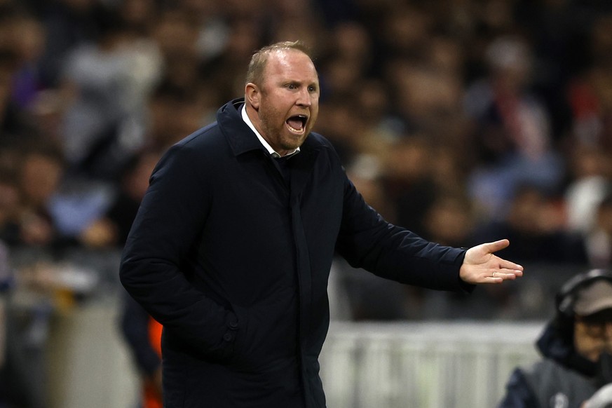 epa12476047 Ludovic Magnin head coach of FC Basel gestures during the UEFA Champions League phase match between Olympique Lyon and FC Basel 1893, in Decines-Chapieu, France, 23 October 2025. EPA/Guill ...