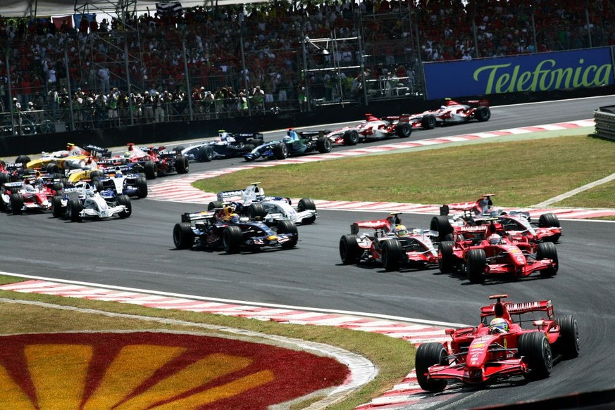 Brazilian Ferrari Formula One driver Felipe Massa driving his Ferrari F2007 car ahead of his Finnish teammate Kimi Raikkonen, Lewis Hamilton and Fernando Alonso in their McLaren MP4-22 cars during lap ...