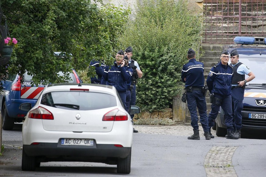 epa08501507 Police officers stand near a house where convicted serial killer Michel Fourniret, formally lived, in Ville-sur-Lumes, France, 22 June 2020. According to police, authorities will start a s ...