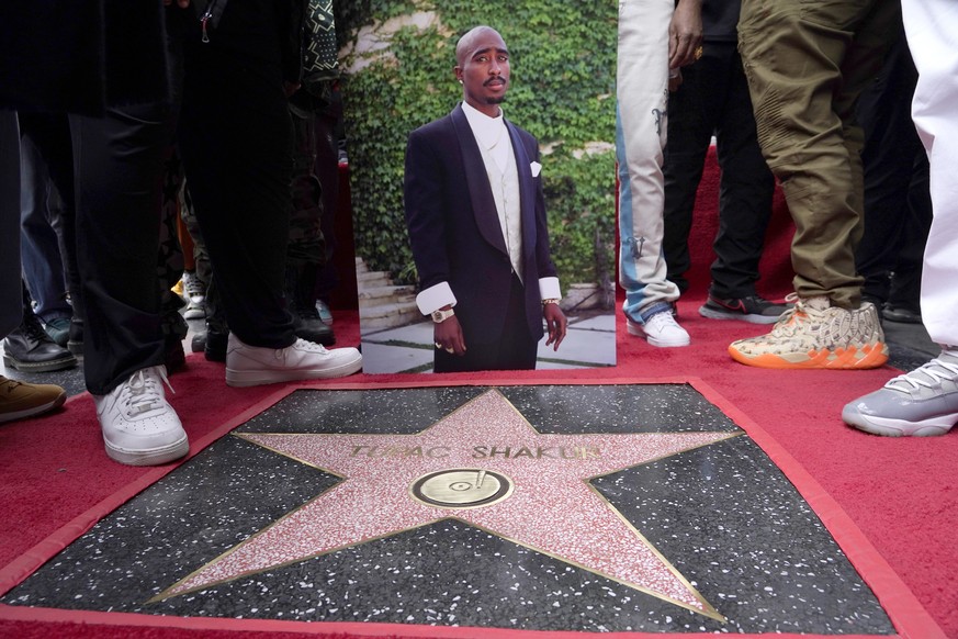 An image of the late rapper/actor Tupac Shakur appears near his new star on the Hollywood Walk of Fame during a posthumous ceremony in his honor on Wednesday, June 7, 2023, in Los Angeles. (AP Photo/C ...