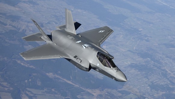 In this image provided by the U.S. Air Force, a U.S. Air Force F-35 Lightning II aircraft assigned to the 34th Fighter Squadron, departs from a KC-10 Extender aircraft after receiving fuel over Poland ...