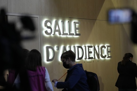 People arrive at the special court on the last day of the Paris attacks trial, Monday, June 27, 2022 in Paris. For Salah Abdeslam, the only surviving member of that night&#039;s Islamic State attack t ...