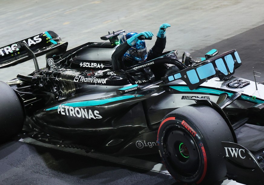 epa12430244 Mercedes driver George Russell of Britain celebrates in his car after taking pole position during the Qualifying for the Formula One Singapore Grand Prix in Singapore, 04 October 2025. The ...
