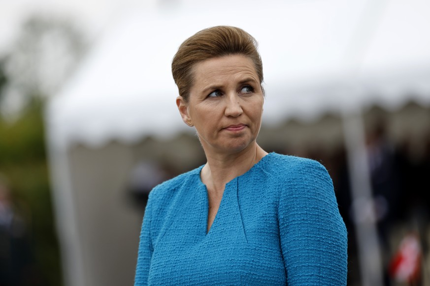 FILE - Denmark's Prime Minister Mette Frederiksen attends a ceremony at the Danish monument outside of Sainte Marie du Mont, Normandy, Thursday, June 6, 2024. Frederiksen has been assaulted by a ...