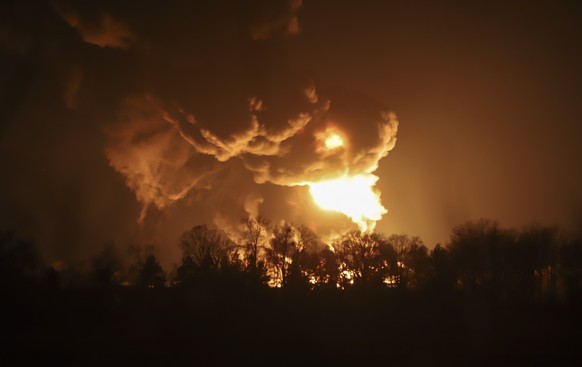 epa09788148 A big fire at a petroleum storage depot after a Russian missile attack, in Vasylkiv, near Kiev, Ukraine, 27 February 2022. Russian troops launched a major military operation on Ukraine on  ...