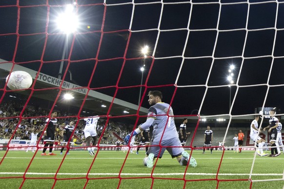Lugano&#039;s goalkeeper Amir Saipi looks at the ball after Fenerbahce&#039;s Edin Dzeko scored his side&#039;s second goal during a UEFA Champions League qualifying second round first leg soccer matc ...