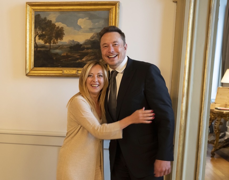 epa10693365 A handout picture made available by the Chigi Palace (Palazzo Chigi) Press Office shows Italian Prime Minister Giorgia Meloni meeting with Tesla and SpaceX CEO Elon Musk (R) at Chigi Palac ...