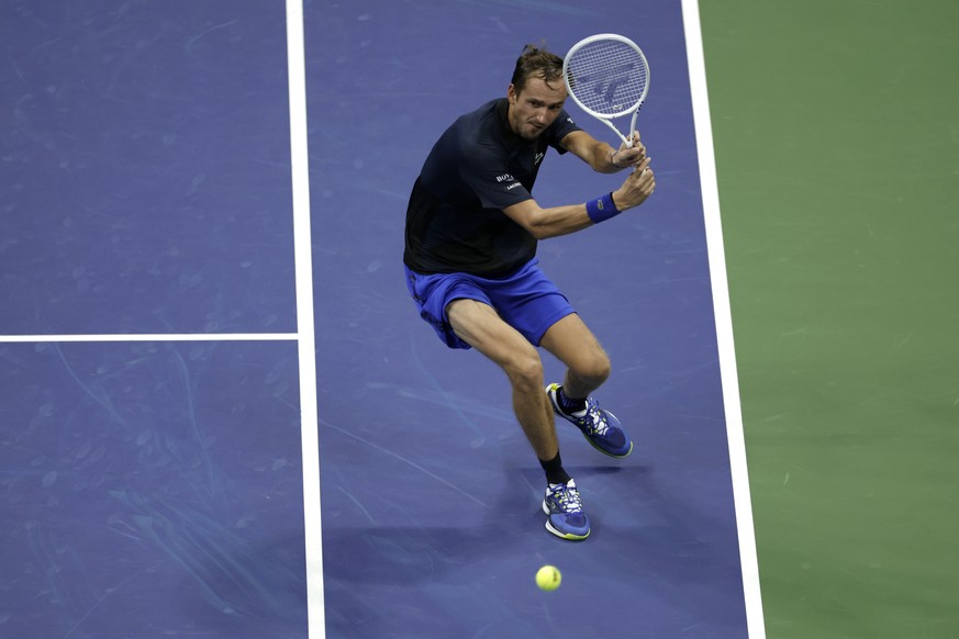 Daniil Medvedev, of Russia, returns a shot to Nick Kyrgios, of Australia, during the fourth round of the U.S. Open tennis championships, Sunday, Sept. 4, 2022, in New York. (AP Photo/Adam Hunger)
Dani ...