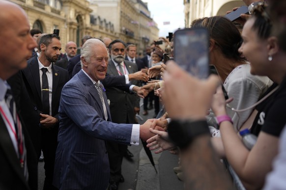 Britain&#039;s King Charles III cheers residents during a walk from the Elysee Palace to the British ambassador to France&#039;s residence, Wednesday, Sept. 20, 2023 in Paris. King Charles III of the  ...