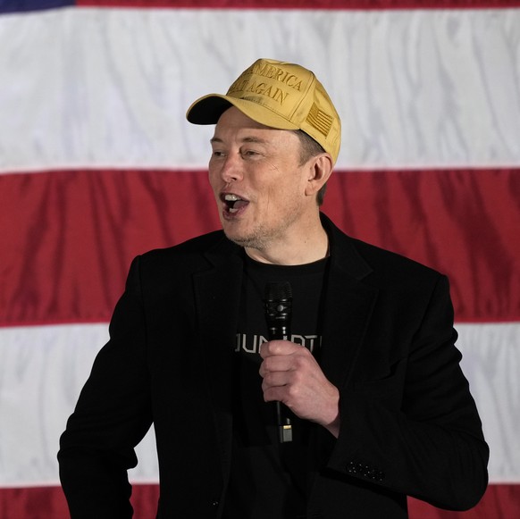 Elon Musk speaks as part of a campaign town hall in support of Republican presidential nominee former President Donald Trump in Folsom, Pa., Thursday, Oct. 17, 2024. (AP Photo/Matt Rourke)