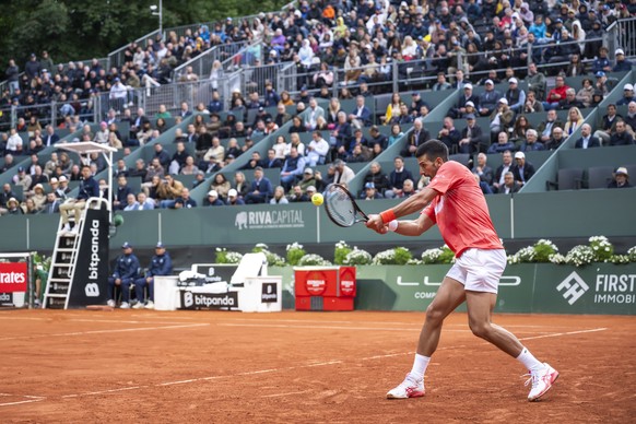 Novak Djokovic, of Serbia, returns a ball to Matteo Arnaldi of Italy, during their quarter-final match, at the ATP 250 Geneva Open tournament in Geneva, Switzerland, Thursday, May 22, 2025. (KEYSTONE/ ...