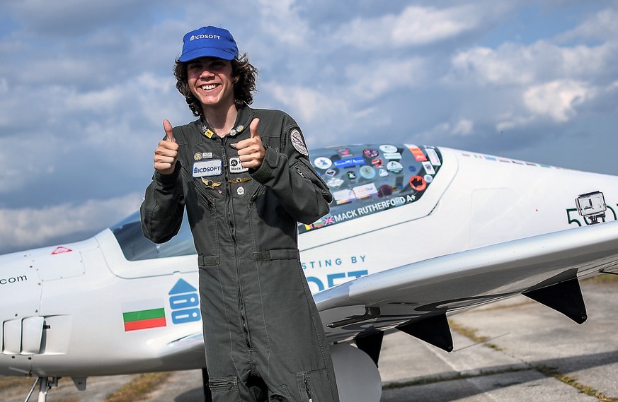 epa10136535 The 17-year-old Mack Rutherford posing for a picture after landing his airplane successfully at Skydive West Airport of Sofia, Bulgaria, 24 August 2022. Mack Rutherford succeeded in his at ...