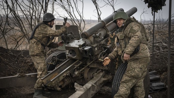 Ukrainian soldiers of the 71st Jaeger Brigade fire a M101 howitzer towards Russian positions at the frontline, near Avdiivka, Donetsk region, Ukraine, Friday, March 22, 2024. (AP Photo/Efrem Lukatsky)