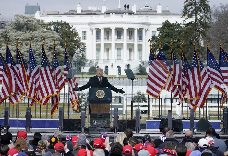 FILE - In this Jan. 6, 2021, file photo, with the White House in the background, President Donald Trump speaks at a rally in Washington. On Monday, Jan. 10, 2022, attorneys for former President Trump  ...