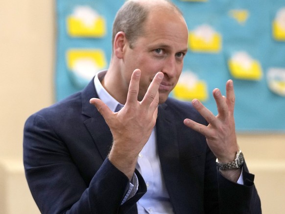 Britain&#039;s Prince William and Kate, the Duke and Duchess of Cambridge speak with partners and supporters during a visit to housing charity Jimmy&#039;s in Cambridge, England, Thursday, June 23, 20 ...