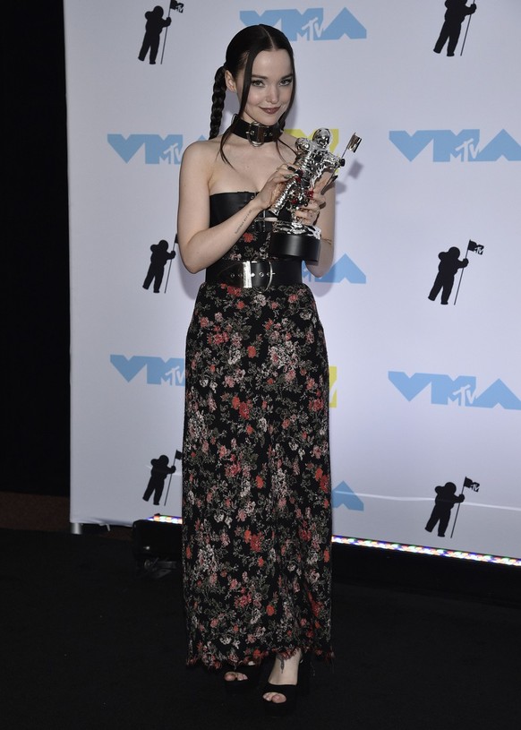 Dove Cameron poses in the press room with her award for best new artist poses at the MTV Video Music Awards at the Prudential Center on Sunday, Aug. 28, 2022, in Newark, N.J. (Photo by Evan Agostini/I ...