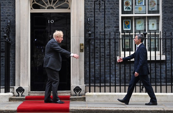 epa09913853 British Prime Minister Boris Johnson (L) ahead of a meeting with President of Switzerland Ignazio Cassis (R) at 10 Downing Street in London, Britain, 28 April 2022. EPA/ANDY RAIN