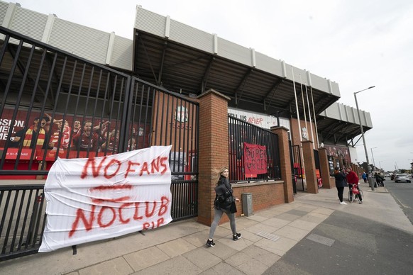 Banners are seen outside Liverpool&#039;s Anfield Stadium after the collapse of English involvement in the proposed European Super League, Liverpool, England, Wednesday, April 21, 2021. Liverpool owne ...