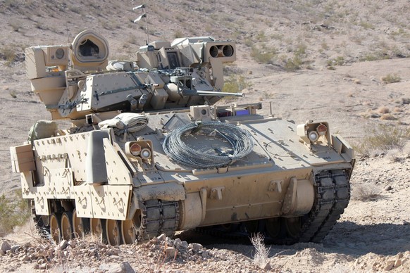 An M2 Bradley Fighting Vehicle is on display during a training exercise at the National Training Center in Fort Irwin, Calif., Feb. 18, 2013. The live, virtual and constructive training environment of ...