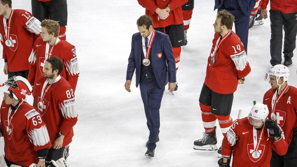 Patrick Fischer, centre, head coach of Switzerland national ice hockey team, between his look disappointed after losing against team Sweden, during the shootout of the IIHF 2018 World Championship Gol ...