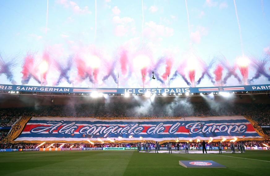PARIS, FRANCE - APRIL 28: General view inside the stadium as fans of Paris Saint-Germain display a tifo whilst fireworks are set off prior to the UEFA Champions League 2025/26 Semi Final First Leg mat ...
