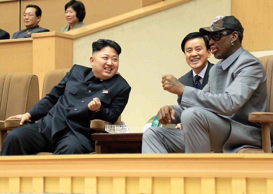 FILE - In this photo provided by the North Korean government, North Korean leader Kim Jong Un, left, talks with former NBA player Dennis Rodman, right, as they watch an exhibition basketball game at a ...