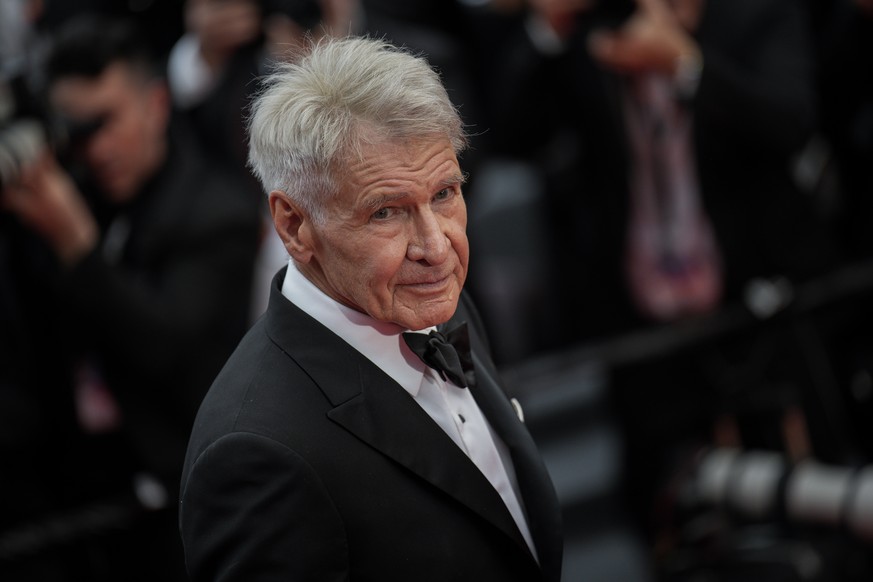 Harrison Ford poses for photographers upon arrival at the premiere of the film &#039;Indiana Jones and the Dial of Destiny&#039; at the 76th international film festival, Cannes, southern France, Thurs ...