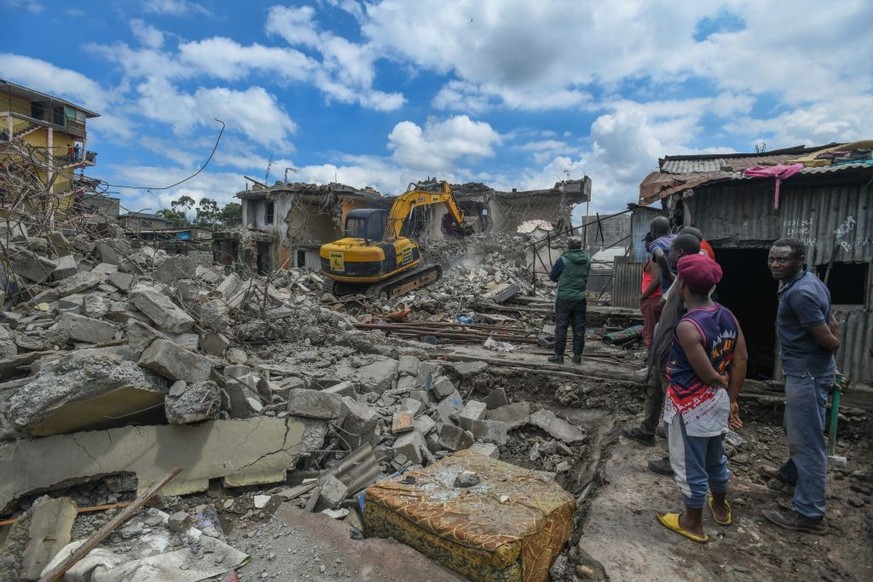 NAIROBI, KENYA - MAY 17: Construction equipment arrive to intervene in the region and demolished numerous buildings as accompanied by security forces following the devastating flood in Nairobi, Kenya  ...