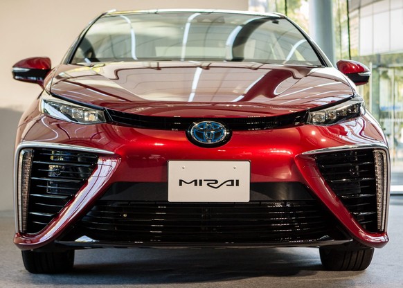 epa04493906 Toyota Motor Corporation&amp;#039;s all-new fuel cell vehicle (FCV) sedan called &amp;#039;Mirai&amp;#039; which means future in Japanese, is shown on display during an unveiling ceremony  ...