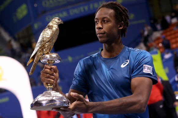 DOHA, QATAR - JANUARY 06 : Gael Monfils of France poses with the trophy after winning against Andrey Rublev (not seen) of Russia in the Qatar ExxonMobil Open 2018 Tennis Tournament Men&#039;s Final ma ...
