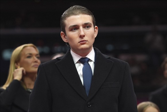 Barron Trump watches as President Donald Trump attends an indoor Presidential Inauguration parade event at Capital One Arena, Monday, Jan. 20, 2025, in Washington. (AP Photo/Evan Vucci)