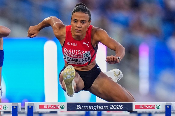 Switzerland's Ditaji Kambundji competes in a women's 100 meters hurdles semifinal at the European Athletics Championships in Birmingham, England, Tuesday, Aug. 11, 2026. (AP Photo/Petr David ...