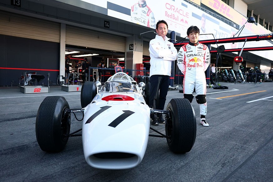 SUZUKA, JAPAN - APRIL 03: Koji Watanabe, President of Honda Racing Corporation, Yuki Tsunoda of Japan and Oracle Red Bull Racing and the Honda RA272 in the Pitlane during previews ahead of the F1 Gran ...