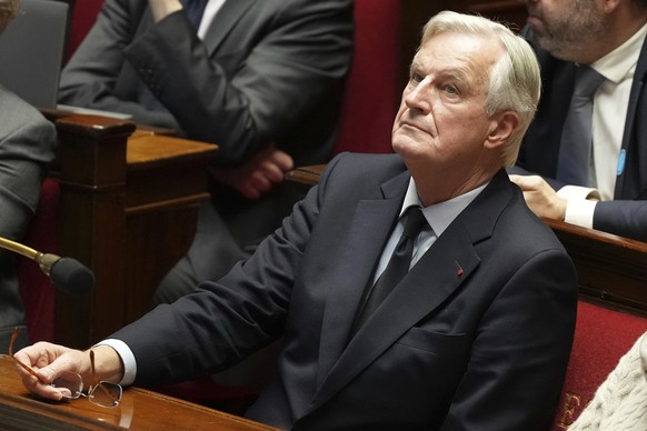 FILE - French Prime Minister Michel Barnier attends a debate at the National Assembly while France&#039;s minority government may be on its last legs as opposition lawmakers moved this week toward a n ...