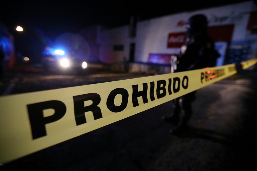 epa05783034 The state and federal police guard a crime scene in Colonia Lindavista, Tepic, Mexico, 10 February 2017, where alleged drug trafficker Juan Francisco Padron Sanchez, alias 'El H-2 ...