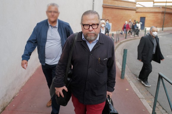 The lawyer of the family of Martine Escadeillas, Frederic David (C) arrives with relatives of the victim on the day of the opening of the trial of Jo�l Bourgeon, at the Haute-Garonne Assize Court in T ...
