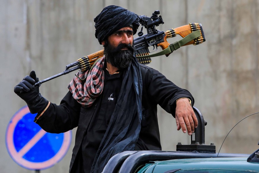 epa10102626 Taliban security stand guard in the neighborhood where a US drone strike killed the Al-Qaeda leader Ayman al-Zawahiri, in Kabul, Afghanistan, 02 August 2022. US President Biden announced o ...