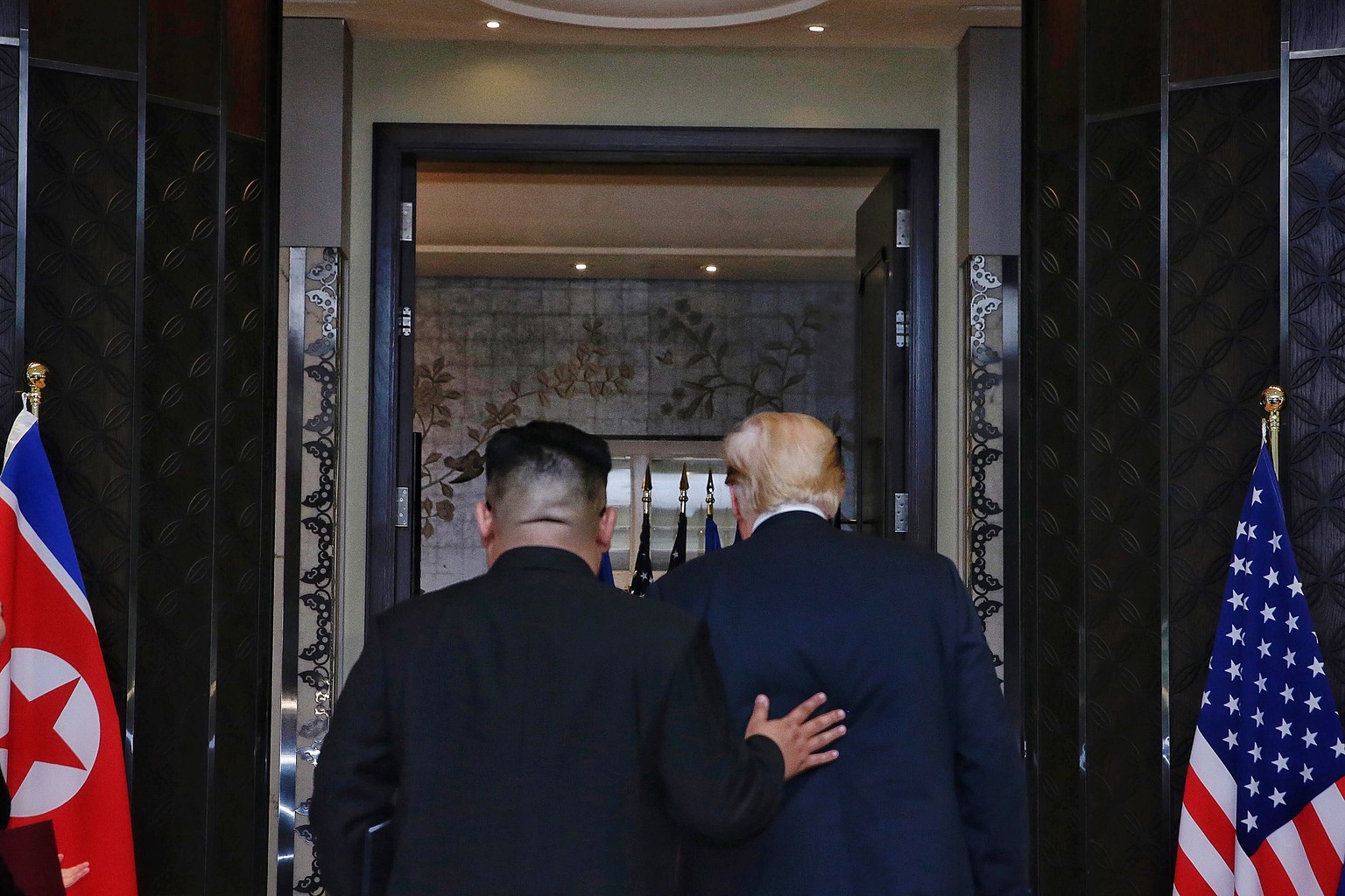 epa06970164 (FILE) - US President Donald J. Trump (R) and North Korean Chairmain Kim Jong-un (L) depart after a signing ceremony during their historic DPRK-US summit, at the Capella Hotel on Sentosa I ...