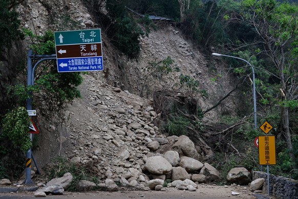 epa11261911 Fallen rocks and debris block a vehicle passage near the Taroko National Park, following the April 03 earthquake that hit the island, in Hualien, Taiwan, 05 April 2024 9issued 06 April 202 ...