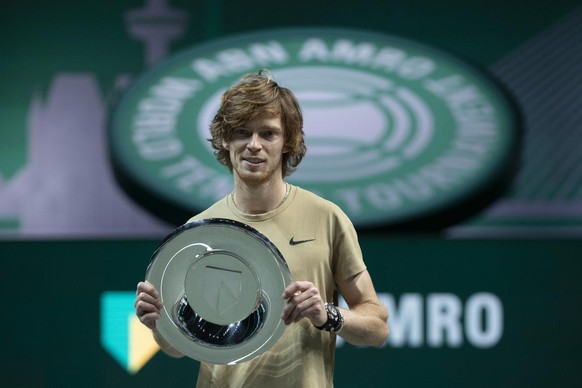 Russia&#039;s Andrey Rublev poses with the trophy after winning in two sets 7-6, 6-4, against Hungary&#039;s Marton Fucsovics in the final men&#039;s singles match of the ABN AMRO world tennis tournam ...