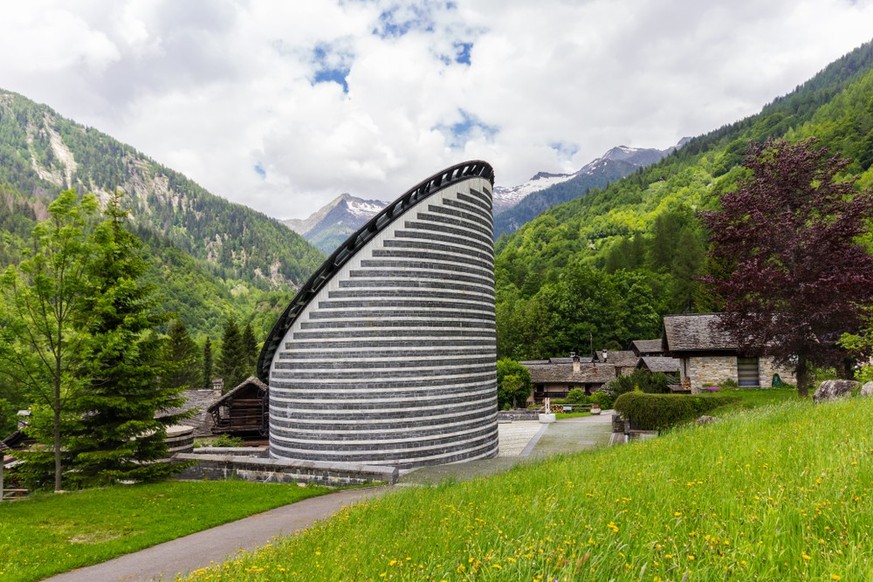 Mogno, Switzerland - June 01, 2018: the Church of San Giovanni Battista by the famous architect Mario Botta, built in Maggia Valley (Val Lavizzara) at 1180 m.