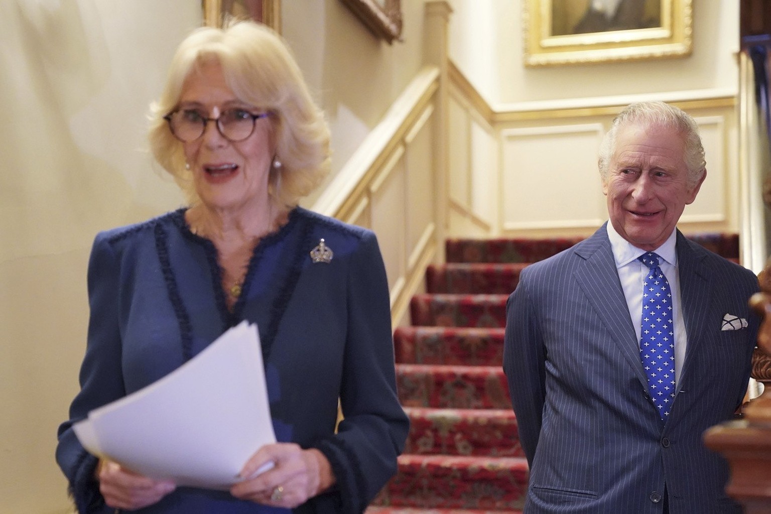 Camilla, the Queen Consort, joined by King Charles III, speaks as she hosts a reception at Clarence House in London, for authors, members of the literary community and representatives of literacy char ...