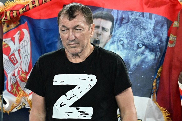 epa10428293 A spectator wears a &#039;Z&#039; on his t-shirt as Novak Djokovic of Serbia takes on Andrey Rublev of Russia during their quarterfinal match at the 2023 Australian Open tennis tournament  ...