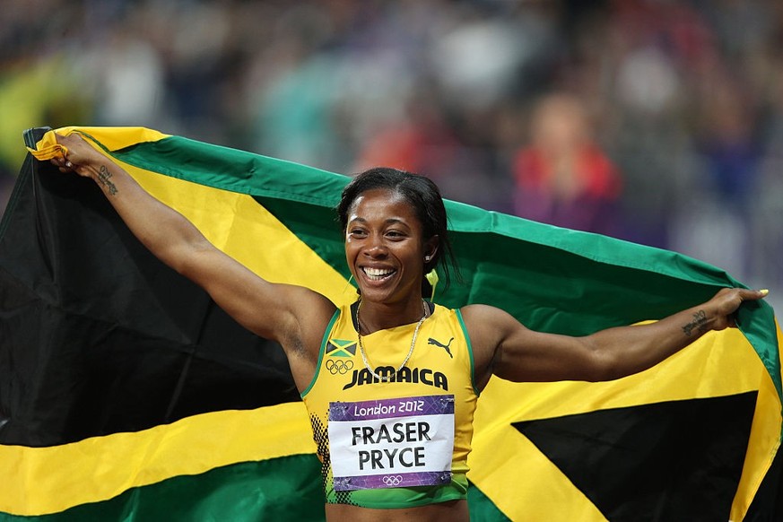 Shelly-Ann Fraser-Pryce, Jamaica, celebrates after winning the Gold Medal in the Women&#039;s 100m Final at the Olympic Stadium, Olympic Park, during the London 2012 Olympic games. London, UK. 4th Aug ...