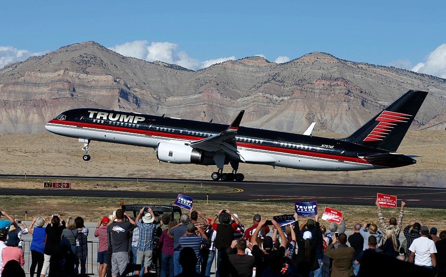 GRAND JUNCTION, CO - OCTOBER 18: Supporters cheer as the plane of Republican presidential candidate Donald Trump lands on October 18, 2016 in Grand Junction Colorado. Trump, who spoke at a rally after ...