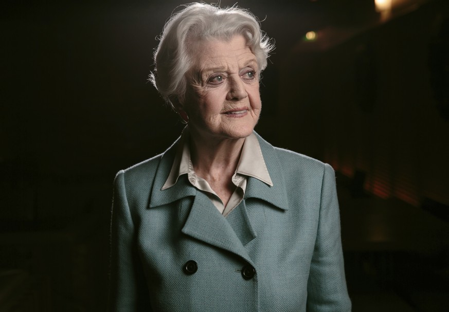 FILE - Angela Lansbury poses for a portrait during press day for &quot;Blithe Spirit&quot; in Los Angeles on Dec. 16, 2014. Lansbury, the big-eyed, scene-stealing British actress who kicked up her hee ...