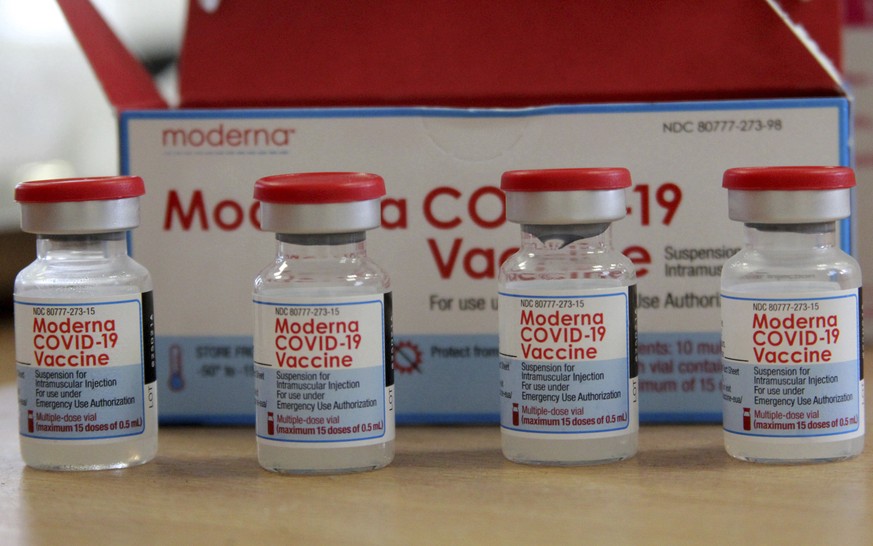 A view of vials of the Moderna COVID-19 vaccine, at the Assad Iben El Fourat school in Oued Ellil, outside Tunis, Sunday, Aug. 15, 2021. Tunisia has launched its largest COVID-19 vaccination campaign  ...