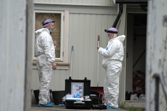 epa09526650 Police technicians investigate in the apartment of the attacker in Kongsberg, Norway, 16 October 2021. Five people were confirmed dead in an attack on 13 October by a man with a bow-and-ar ...