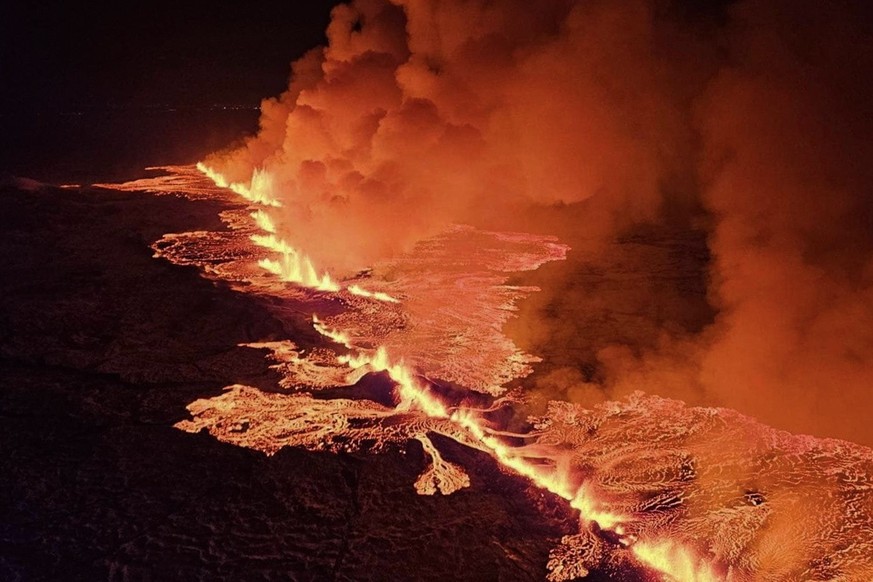 A handout picture provided by Iceland Civil Defense shows a volcanic eruption north of Grindavik, Iceland, 18 December 2023. The Icelandic Meteorological and Seismological Office (MET) reported late 1 ...
